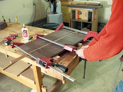 Gluing up and clamping country tabletop and cherry insert strip