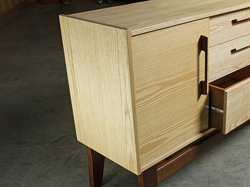 Ash sideboard with a vertical grain pattern