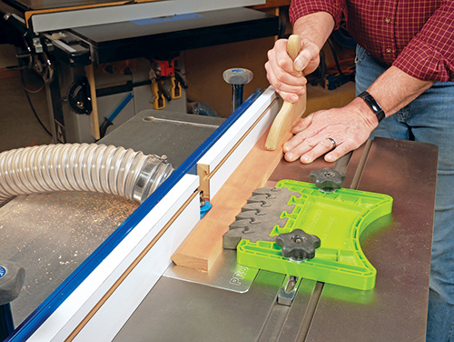 Guiding hardwood edging cut on convex router bit