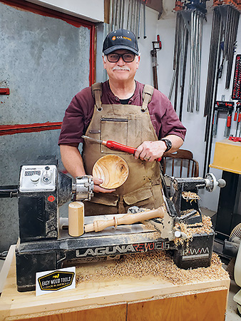 Veteran showing projects he turned on his lathe
