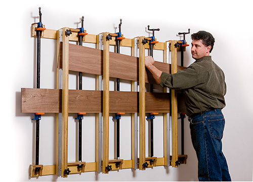 Placing panel parts in wall mounted press