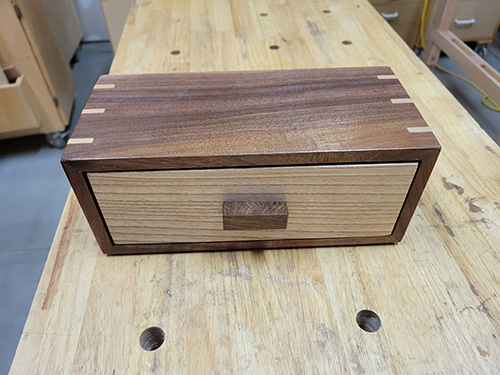 Top view of walnut box with drawer