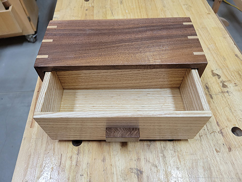 Walnut box with open drawer