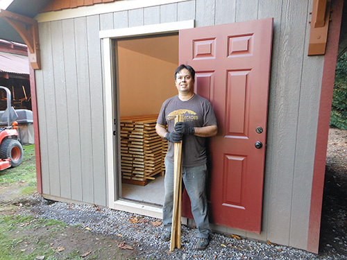 Lumber drying in a kiln built in a backyard