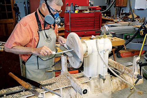 Turning and smoothing Windsor stool seat