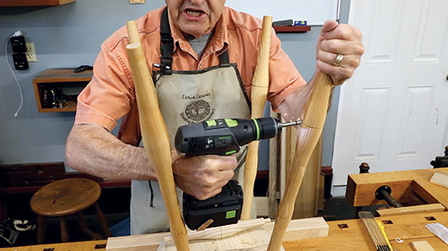 Drilling WIndsor stool stretcher holes