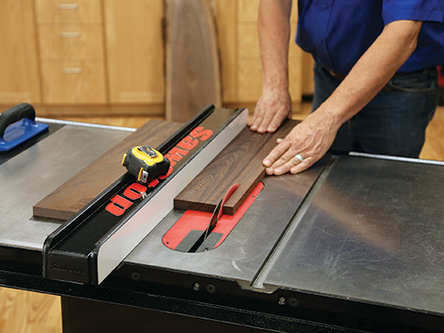 Cutting wood to make side panels for wine cabinet