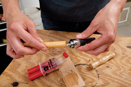 Applying glue to corkscrew handle