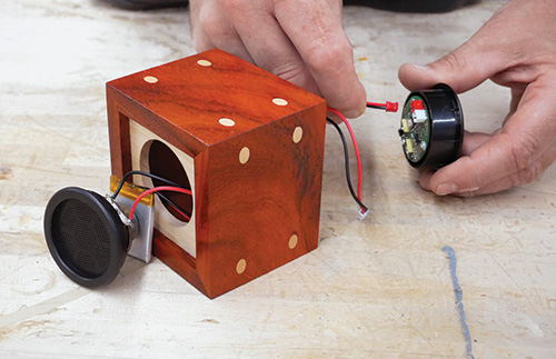 Installing speaker components in wireless speaker case