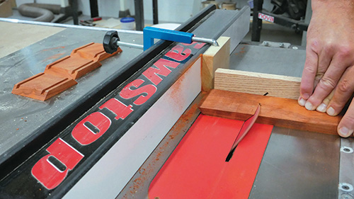 Cutting the four sides of a small wireless speaker cabinet on a table saw