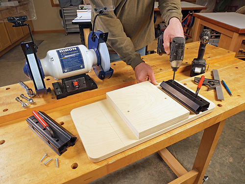 Attaching mounting plates to grinding jig base