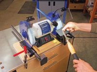 Benchtop grinder with sharpening jig attached