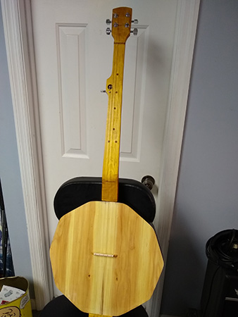 Front view of a wooden banjo