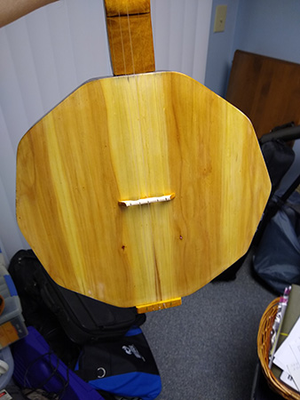 View of base of wooden banjo