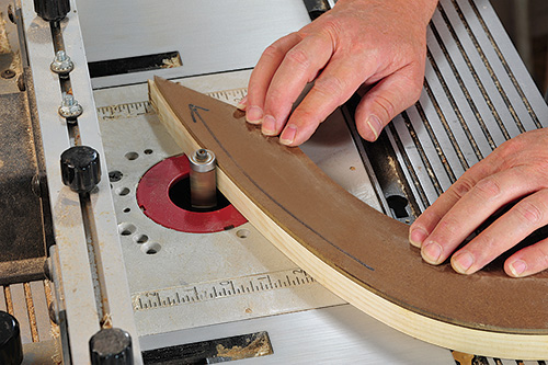 Trimming end of foot of music stand using template guide