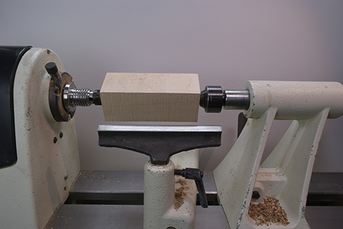 Turning on lathe between two spindles