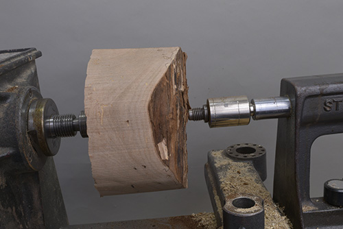 Large bowl blank between two lathe centers