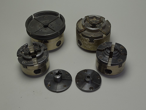 Collection of various four-jaw chucks