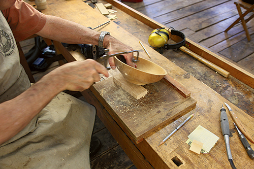 Cut to the layout lines with a coping saw (third photo), using a blade that cuts in any direction.