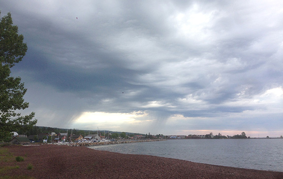 The way the light is illuminating Grand Marais, captivates my sentiments on the sleepy little town. I camped in the campground that is next to NHFS, and it is directly behind me in this photo. You can walk to the school (red and blue buildings on the left) and most places in town. The weather changes often, and so be prepared for a range of weather conditions.