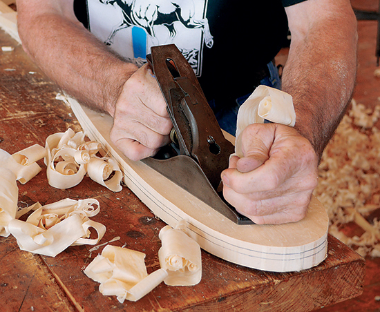 1. The tip and edges of the paddle’s blade should be 1/4" thick or slightly less. Mark this thickness on the edge of the blade. Use a jack or smoothing plane to taper the blade faces. Start the taper 2" to 3" below the intersection of the blade and the shaft. 
