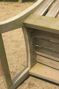 These bench seat slats are fastened to the framework with pairs of weather-resistant pocket screws. They aren't budging.