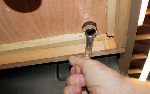 Mark and cut clearance areas in the plywood at each bolt hole location. Check to make sure your wrench has enough access.