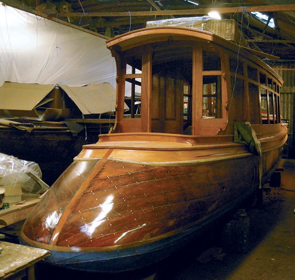 Freebody’s boatyard restores all types of wooden boats, from the steam-powered saloon launch (a party boat for the nobility) at left to clinker-built dinghies like the one pictured above.
