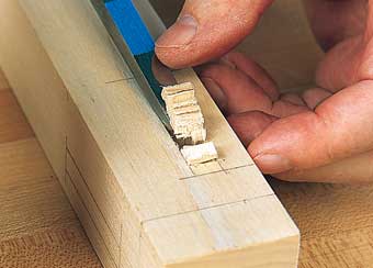 Using the layered method of waste removal, you can lever out the first chip with five chisel cuts.