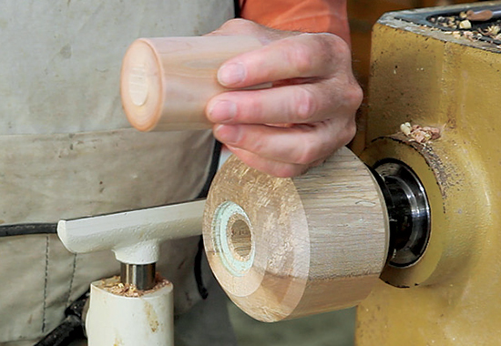 Turn a cylinder from a wood favorable for threading (see page 19; I used dogwood Other good domestic woods are dogwood, pear and desert ironwood. Most fine-grained tropical woods, such as lignum vitae, cocobolo, ebony, African blackwood and rosewood, also take threads well. A good, cheap material to practice on while learning is MDF.) to the diameter of the box you want to make. Chuck the cylinder in a jam chuck and turn the rough shape of your box.