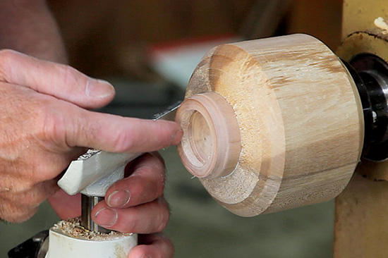 Hollow out the bulk of the lid’s material, then scrape the interior to the desired shape as shown in the lower illustration on the right side of page 19. Scrape the groove next to the shoulder of the mor- tise and chamfer the leading edge to give the chaser an easy start.