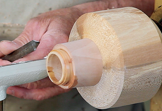Scrape away excess material until you have the bulk of the tenon a bit bigger than the first tenon. (How much bigger depends on the pitch of the thread, with coarse threads needing more material than fine ones.) Scrape a groove at the shoulder of the bigger tenon.