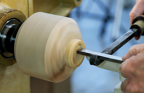 If your lathe is reversible, you can chase from the opposite side of the lathe, and the chaser screws threads out of the lid instead of into it — making an abrupt, thread-destroying stop impossible.